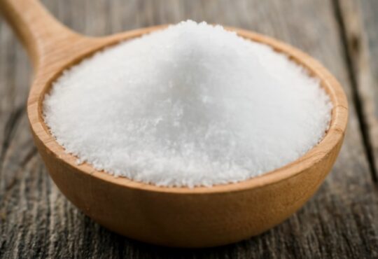 A pile of salt grains representing sodium, a mineral essential for bodily functions and electrolyte balance.