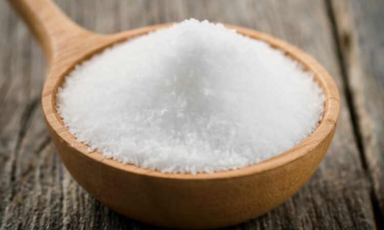 A pile of salt grains representing sodium, a mineral essential for bodily functions and electrolyte balance.